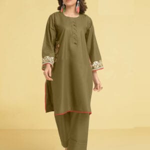 a woman in a green Stitched dress